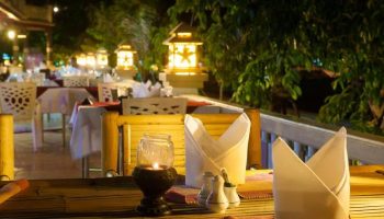 Phi Phi Island Cabana Hotel dining. Gay-friendly hotel restaurant at night with lanterns and table settings. Romantic and inviting.