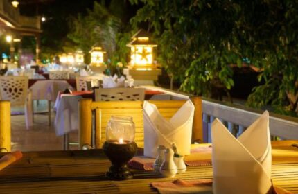 Phi Phi Island Cabana Hotel dining. Gay-friendly hotel restaurant at night with lanterns and table settings. Romantic and inviting.