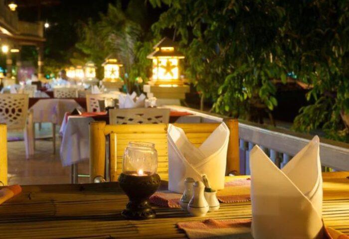 Phi Phi Island Cabana Hotel dining. Gay-friendly hotel restaurant at night with lanterns and table settings. Romantic and inviting.