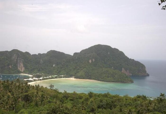 Phi Phi Relax Beach Resort view. Gay-friendly hotel with beach, mountains, and lush greenery. Ideal for gay men travel.