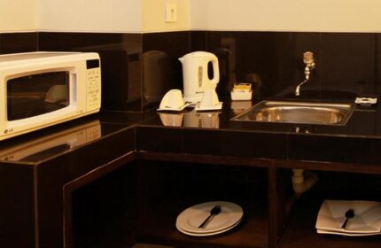 Ping Hotel Seminyak kitchenette. Gay-friendly hotel room features microwave, kettle, and sink. A comfortable stay in Seminyak, Bali.