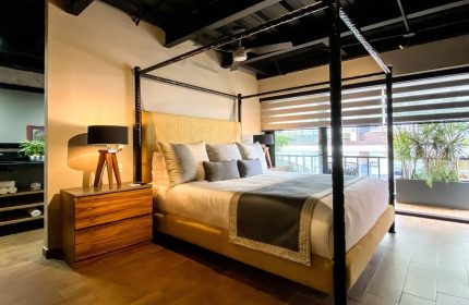 Pinnacle Resorts 179 Adults Only gay-friendly hotel room. Four-poster bed, modern design, balcony view. Ideal for gay travel.