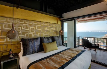 Pinnacle Resorts 179 adults-only, gay-friendly hotel. Room with balcony overlooking the ocean. Gay travel in Puerto Vallarta.