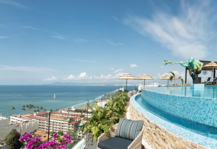 Pinnacle Resorts 179 Adults Only, gay-friendly hotel. Infinity pool overlooking Puerto Vallarta, ocean view. Luxury travel for gay men.