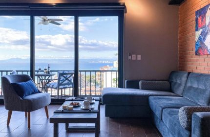 Pinnacle Resorts 179 adults-only gay-friendly hotel living room. Ocean view from balcony. Modern interior design, Puerto Vallarta.