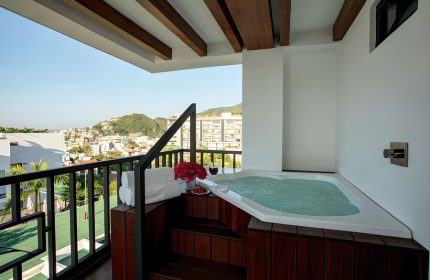 Pinnacle Resorts 179 Adults Only gay-friendly hotel balcony with jacuzzi. View of Puerto Vallarta. Gay travel, luxury vacation.