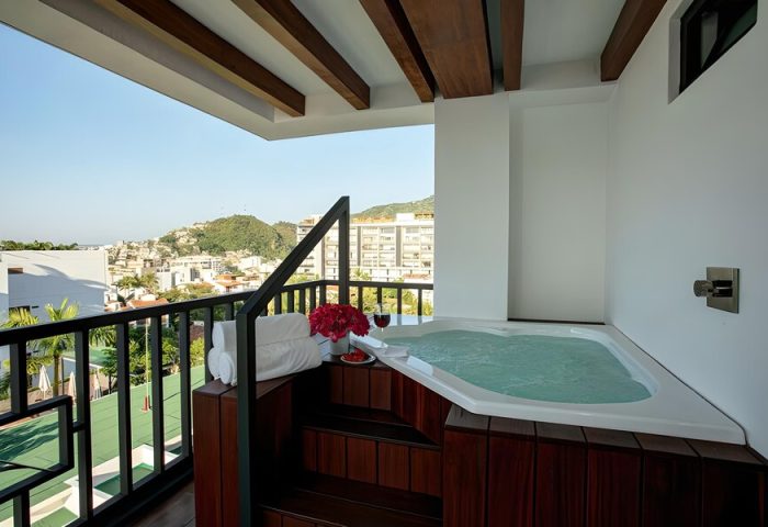 Pinnacle Resorts 179 Adults Only gay-friendly hotel balcony with jacuzzi. View of Puerto Vallarta. Gay travel, luxury vacation.