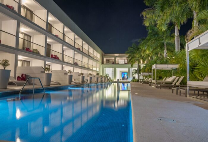Platinum Yucatan Princess All-Inclusive Suites & Spa Resort Adults Only pool at night. Gay-friendly hotel with luxury suites and spa.