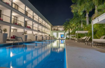 Platinum Yucatan Princess All-Inclusive Suites & Spa Resort Adults Only pool at night. Gay-friendly hotel with luxury suites and spa.