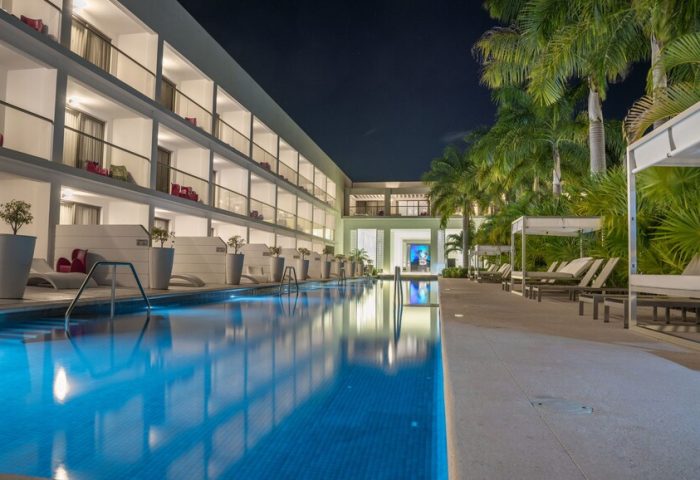 Platinum Yucatan Princess All-Inclusive Suites & Spa Resort Adults Only pool at night. Gay-friendly hotel with luxury suites and spa.