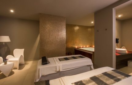 Spa room at Platinum Yucatan Princess All Inclusive Suites Resort Adults Only. Massage beds, jacuzzi, and modern decor for a relaxing getaway. Gay-friendly hotel.