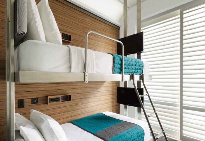 Pod Times Square hotel room with bunk beds. Modern, compact design. A gay-friendly lodging option in New York City. Great for budget travel.