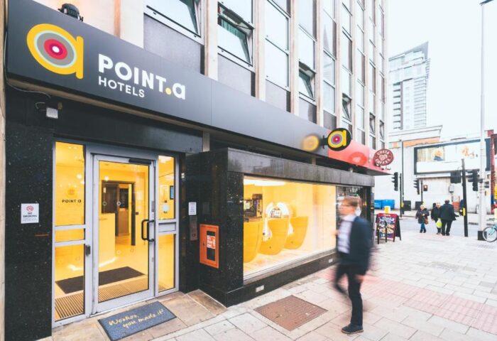 Point A Hotel London Westminster exterior. Gay-friendly hotel with modern design. Entrance view on a city street. Urban lodging.