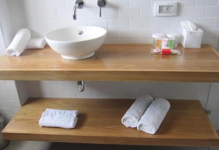 Prima City Tel Aviv Hotel bathroom. Modern sink, towels, and toiletries. Gay-friendly hotel in Tel Aviv for gay men travelers.