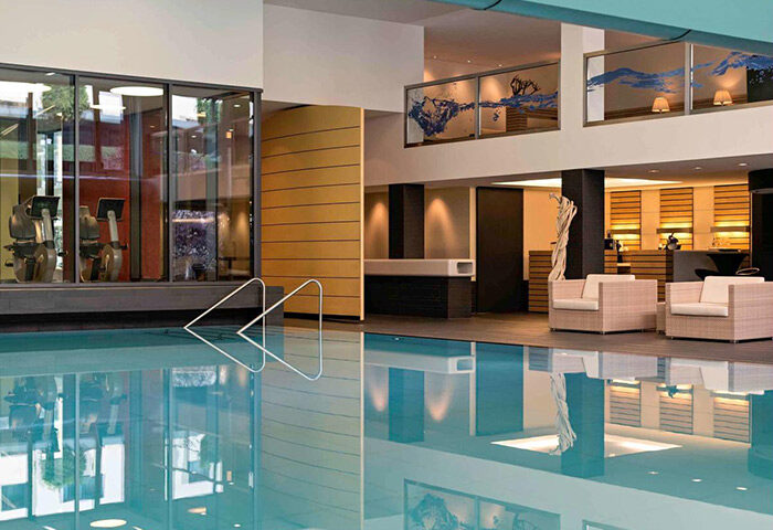 Pool at Gay-Friendly Pullman Berlin Schweizerhof Hotel. Gym, lounge area, and stylish design. Ideal for gay travelers in Berlin, Germany.