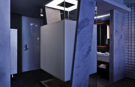 Bathroom at Pullman Jakarta Central Park Hotel, a gay-friendly hotel. Features a modern design with a walk-in shower and sleek fixtures.