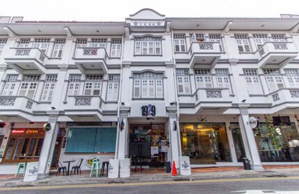 Q Loft Hotel 1929@Chinatown facade. This gay-friendly hotel in Singapore features a vintage design with balconies and shuttered windows.