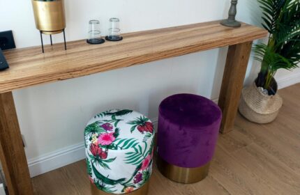 Quentin Golden Bear Hotel detail. A gay-friendly hotel room interior with a table, stools, and plants. Modern decor, travel advice.