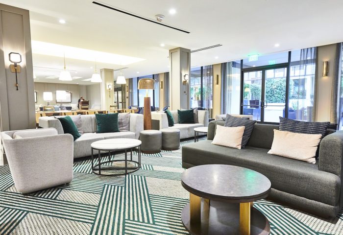 Lobby at the gay-friendly RIU Plaza Fisherman's Wharf hotel. Modern design with couches, chairs, and tables. A great place for gay travelers.