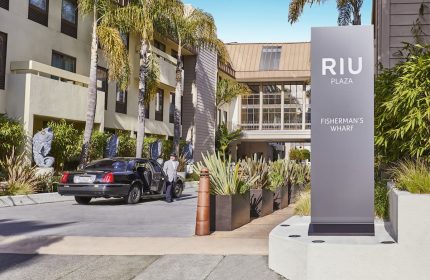 RIU Plaza Fisherman's Wharf hotel exterior. A gay-friendly hotel in San Francisco with car service and modern design elements.