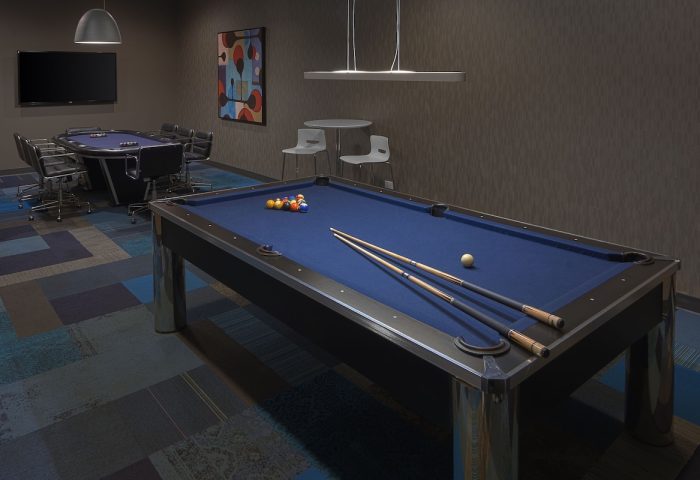 Radisson Blu Aqua Hotel, Chicago game room with pool table and poker table. A gay-friendly hotel amenity for entertainment.