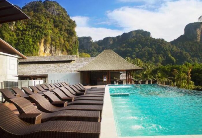 Railay Princess Resort & Spa pool view. Gay-friendly hotel with mountain backdrop, perfect for gay men's travel. Relaxing spa and scenic views.