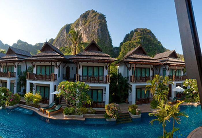 Railay Village Resort pool view. Gay-friendly hotel with mountain backdrop. Tropical villas for gay travel. Railay, Thailand resort.