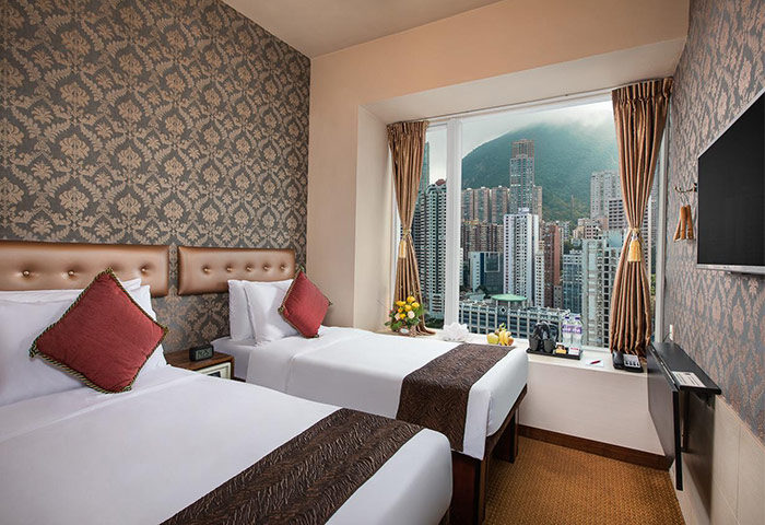 Ramada Hong Kong Harbour View hotel room. Twin beds, city view. Gay-friendly hotel for gay men, offering harbor views from rooms.