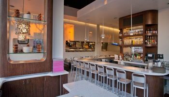 Ramada Plaza by Wyndham West Hollywood Hotel & Suites bar area. Gay-friendly hotel with a full bar and modern design. West Hollywood travel.