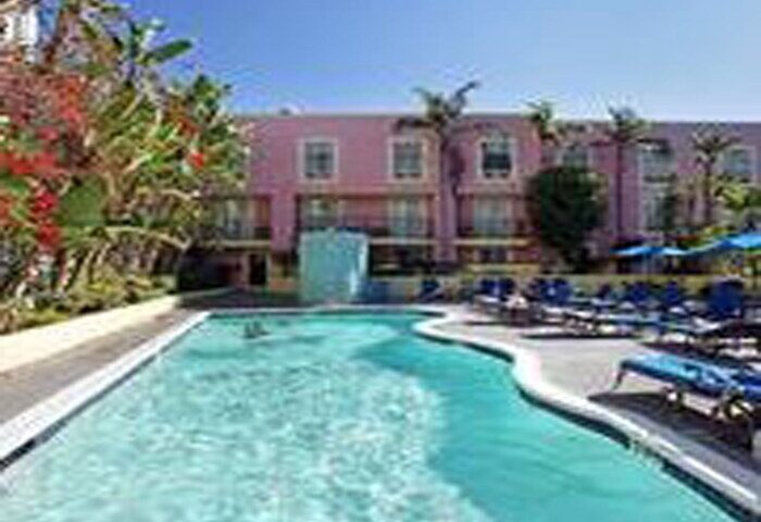 Ramada Plaza by Wyndham West Hollywood Hotel & Suites pool. This gay-friendly hotel offers a relaxing pool area for guests to enjoy.