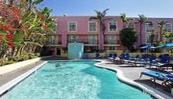 Ramada Plaza by Wyndham West Hollywood Hotel & Suites pool. This gay-friendly hotel offers a relaxing pool area for guests to enjoy.