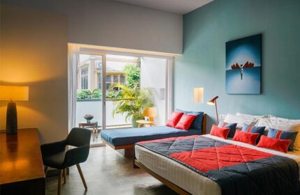 Rambutan Resort, Phnom Penh: Gay-friendly hotel room with double bed, daybed, desk, and balcony. Modern design, comfortable stay.