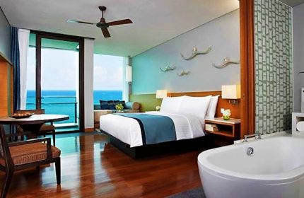 Rayong Marriott Resort & Spa room. Gay-friendly hotel with ocean view, bed, and bathtub. Perfect for gay travel and relaxing spa getaways.