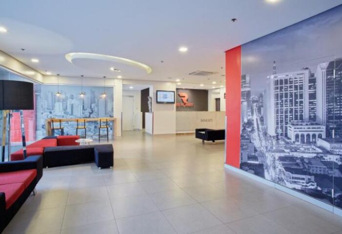 Red Planet Manila Makati's lobby, a gay-friendly hotel. Modern design with city views. Ideal for gay men seeking travel advice in the Philippines.