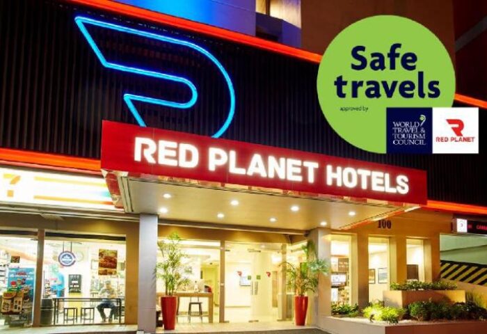 Red Planet Quezon Timog Hotel exterior. Gay-friendly hotel with Safe Travels seal. Modern design, bright lights. A top choice for gay travelers in Quezon.
