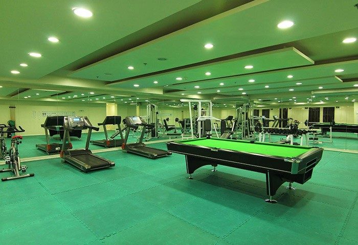 Regency Grand Suites gay-friendly hotel gym. Treadmills, weights, and a pool table provide fitness and recreation for gay travelers.