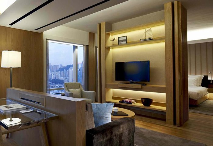 Renaissance Hong Kong Harbour View Hotel room. Gay-friendly hotel with city views, TV, and modern decor. Ideal for gay men travelers.