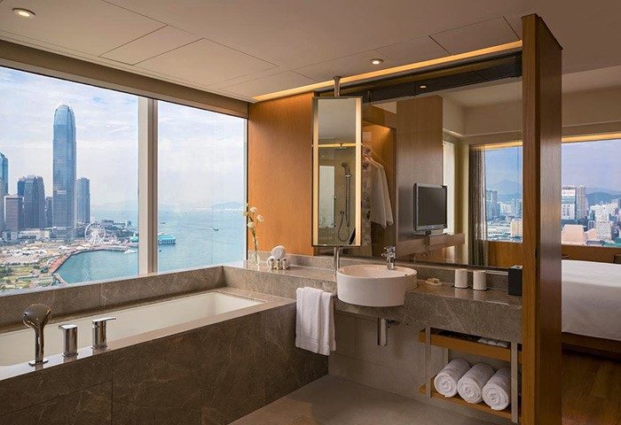 Renaissance Hong Kong Harbour View Hotel bathroom. Harbor view from the bathtub. Gay-friendly hotel with modern amenities. City skyline.