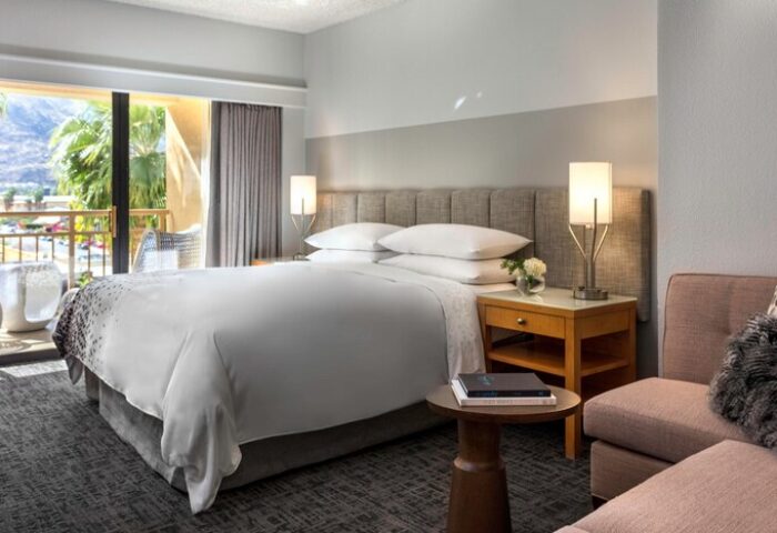 Gay-Friendly Renaissance Palm Springs Hotel room. King bed, balcony with mountain views. Modern design. Ideal for gay travel in Palm Springs.