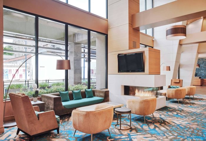 Residence Inn by Marriott Vancouver Downtown lobby. Modern, gay-friendly hotel with fireplace, TV, and comfortable seating.