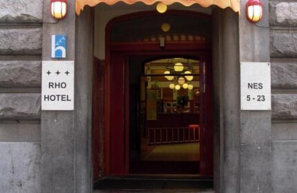Entrance to Rho Hotel, a gay-friendly hotel in Amsterdam. Striped awning above the door. Hotel entrance with address. Facade of Rho Hotel.
