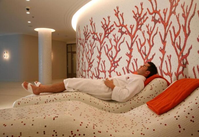 Man relaxing at Rocco Forte The Charles Hotel spa. This gay-friendly hotel offers luxury & wellness for gay men travelers.