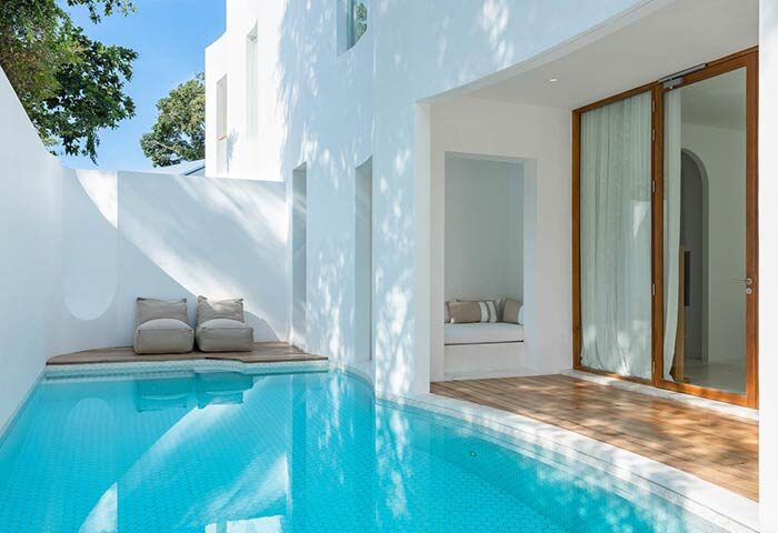 Private pool villa at SALA Samui Chaweng Beach, a gay-friendly hotel. Modern white architecture, bean bag chairs, and direct pool access.