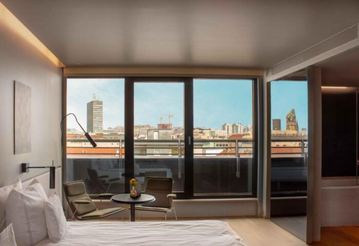 SANA Berlin Hotel gay-friendly room view. Pet-friendly hotel room with a balcony overlooking the Berlin skyline. Modern design.