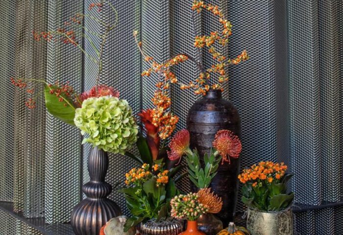 SANA Berlin Hotel fall floral display. Vases with hydrangeas, berries, and protea flowers. Gourds add seasonal charm. Gay-friendly, pet-friendly.