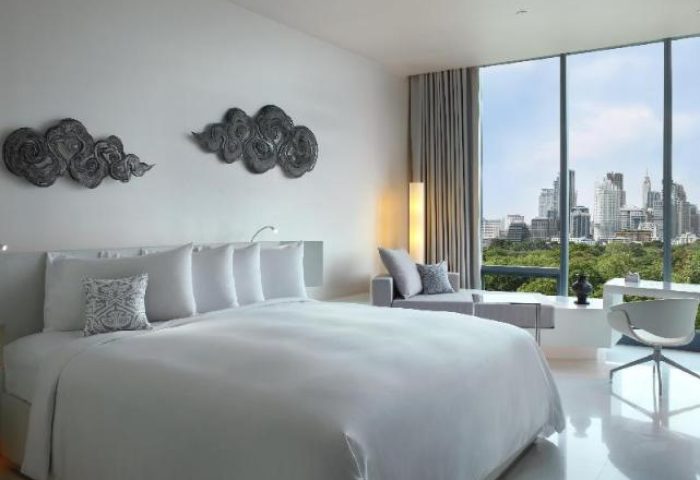 SO/ Bangkok hotel room with a king bed and city view. Gay-friendly hotel with modern design and luxury amenities. Perfect for gay travel in Bangkok.