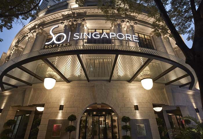 SO/ Sofitel Singapore's facade. This gay-friendly hotel features an elegant entrance and architectural details, perfect for gay travel.