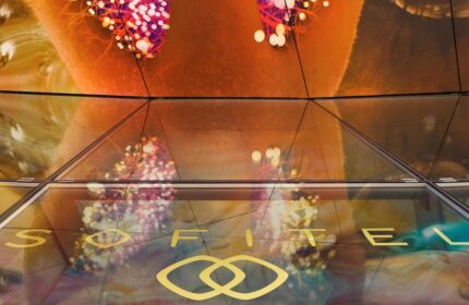 SO/ Vienna gay-friendly hotel detail. Abstract ceiling art and Sofitel logo at this stylish Vienna hotel. Gay travel advice.