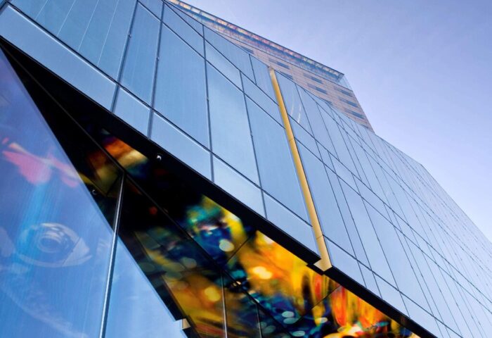 SO/ Vienna, a gay-friendly hotel. Modern glass building with colorful art installation. A great stay for gay travelers in Vienna, Austria.