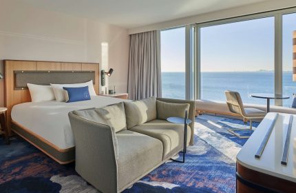 Sable at Navy Pier Chicago, a gay-friendly Curio Collection by Hilton hotel. Room interior with a view of Lake Michigan.